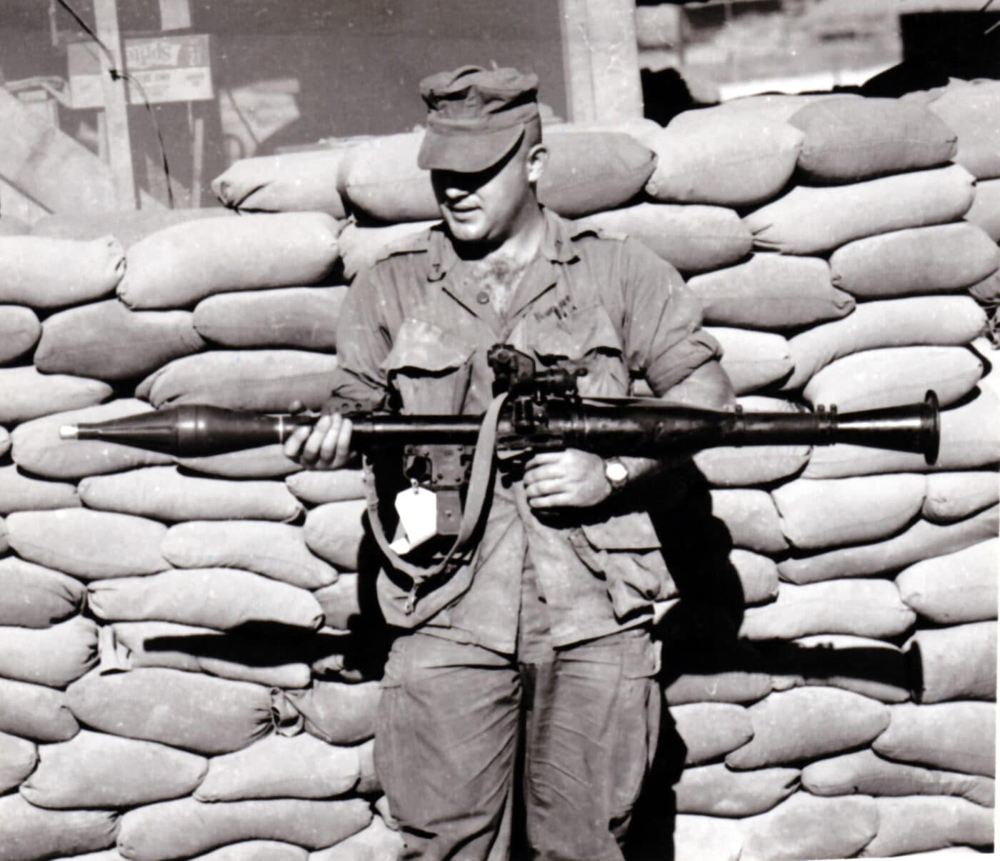 U.S. soldier holding a captured RPG-7 during combat with Viet Cong forces in July 1967
