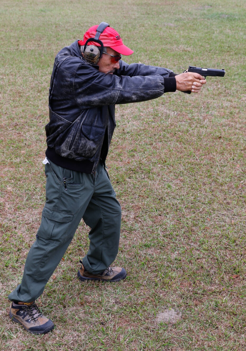 Ayoob showing isosceles shooting stance foot placement