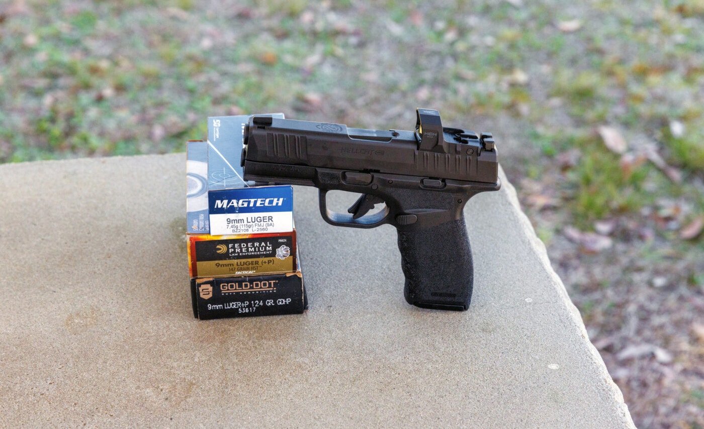 Ammo boxes next to Hellcat Pro pistol