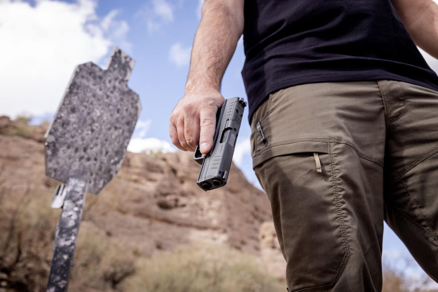 Man holding a Springfield Armory Hellcat Pro pistol