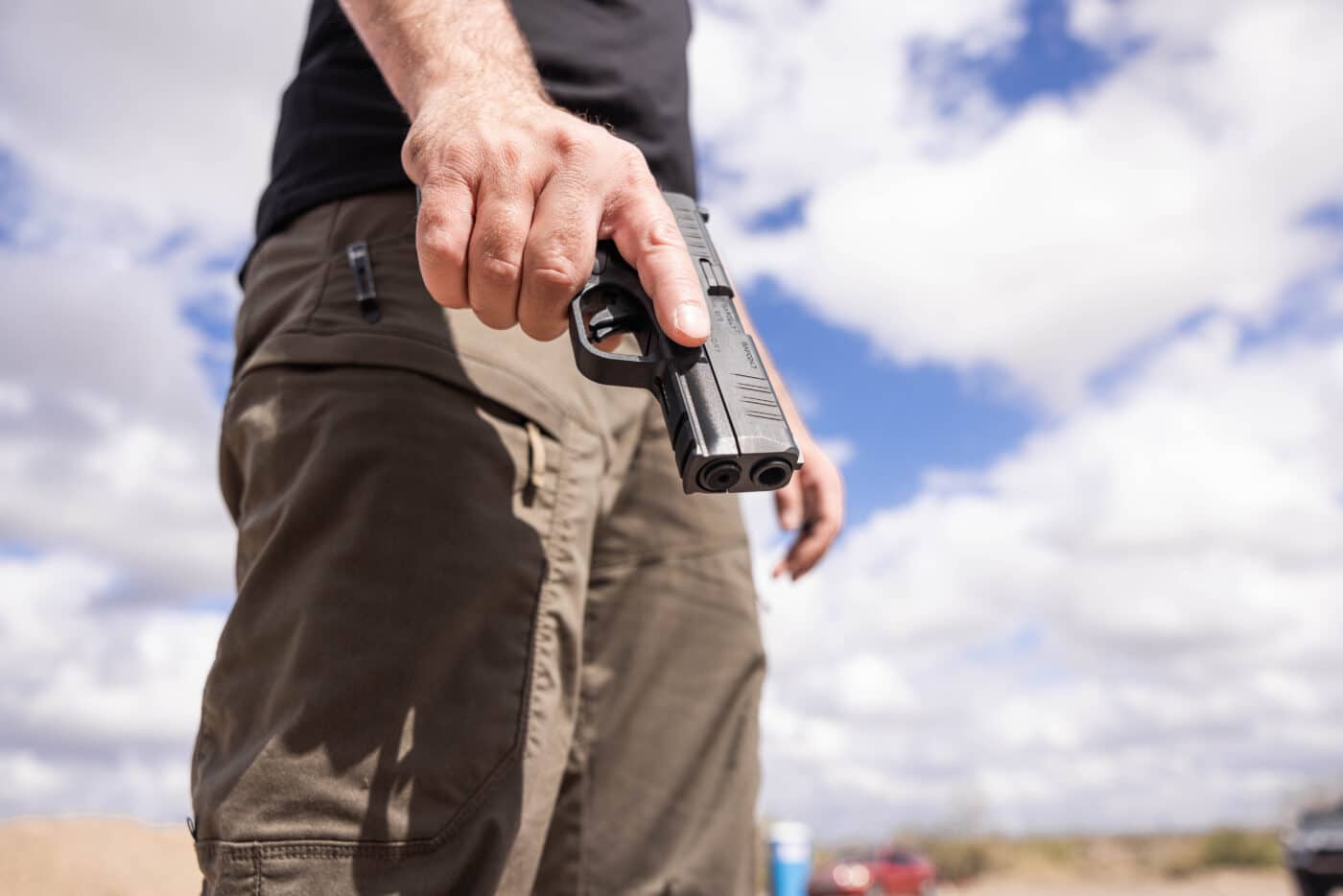 Man holding Springfield Armory Hellcat Pro pistol