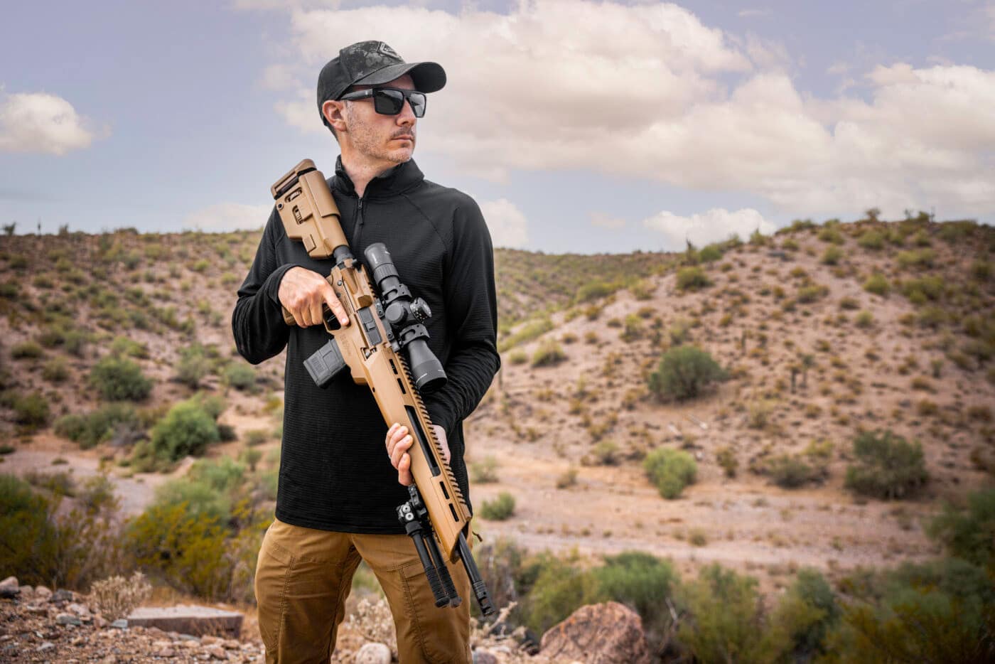 Man holding a SAINT Edge ATC rifle with LaRue trigger