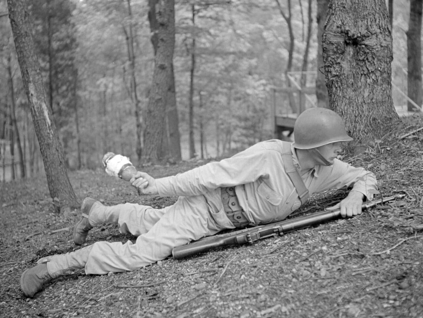 U.S. soldier training with a gas bomb at the Chemical Warfare Center at Fort Belvoir, Virginia during September 1942