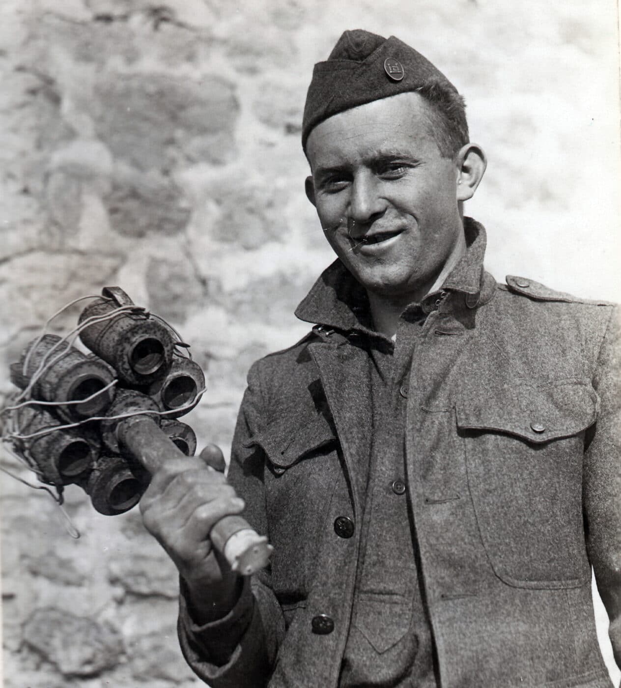 A U.S. Doughboy poses with a captured German “bundled charge” made from seven standard stick grenades