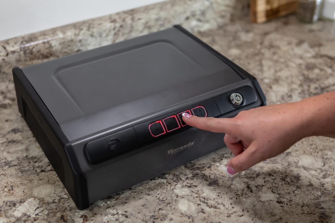 Woman pressing button on Hornady RAPiD Safe Keypad Vault