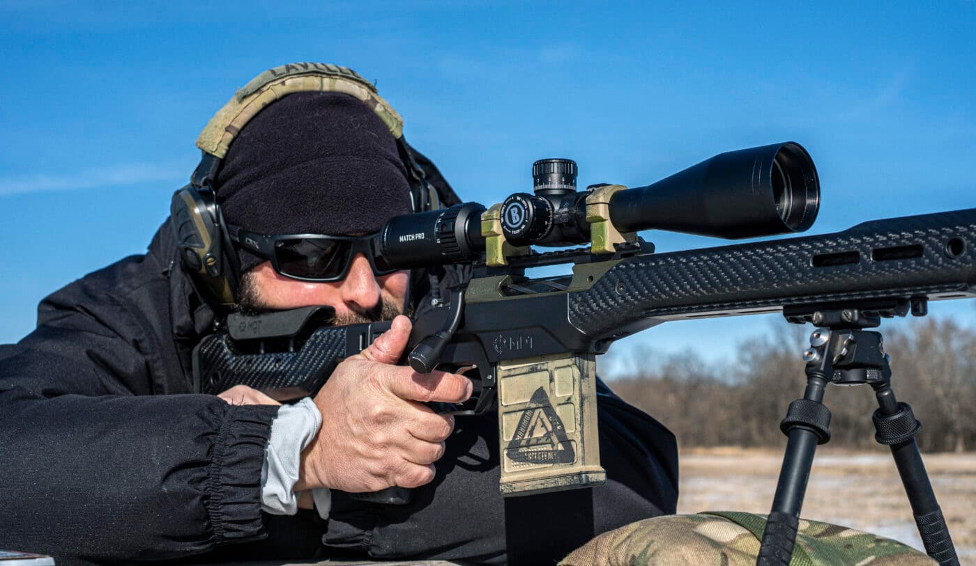 Man shooting Waypoint rifle with Bushnell Match Pro scope mounted