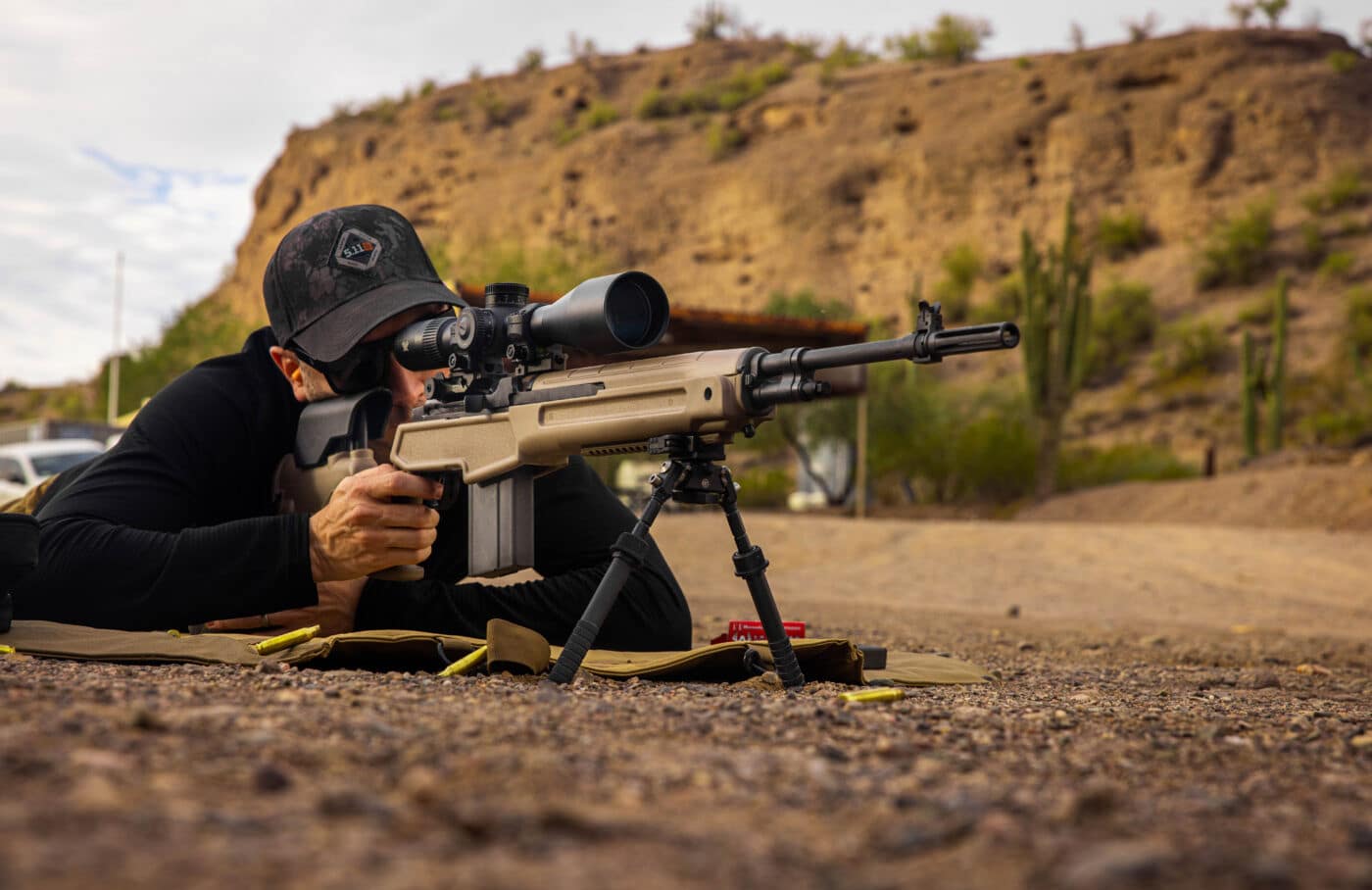 Man shooting Springfield M1A Loaded Precision rifle in FDE