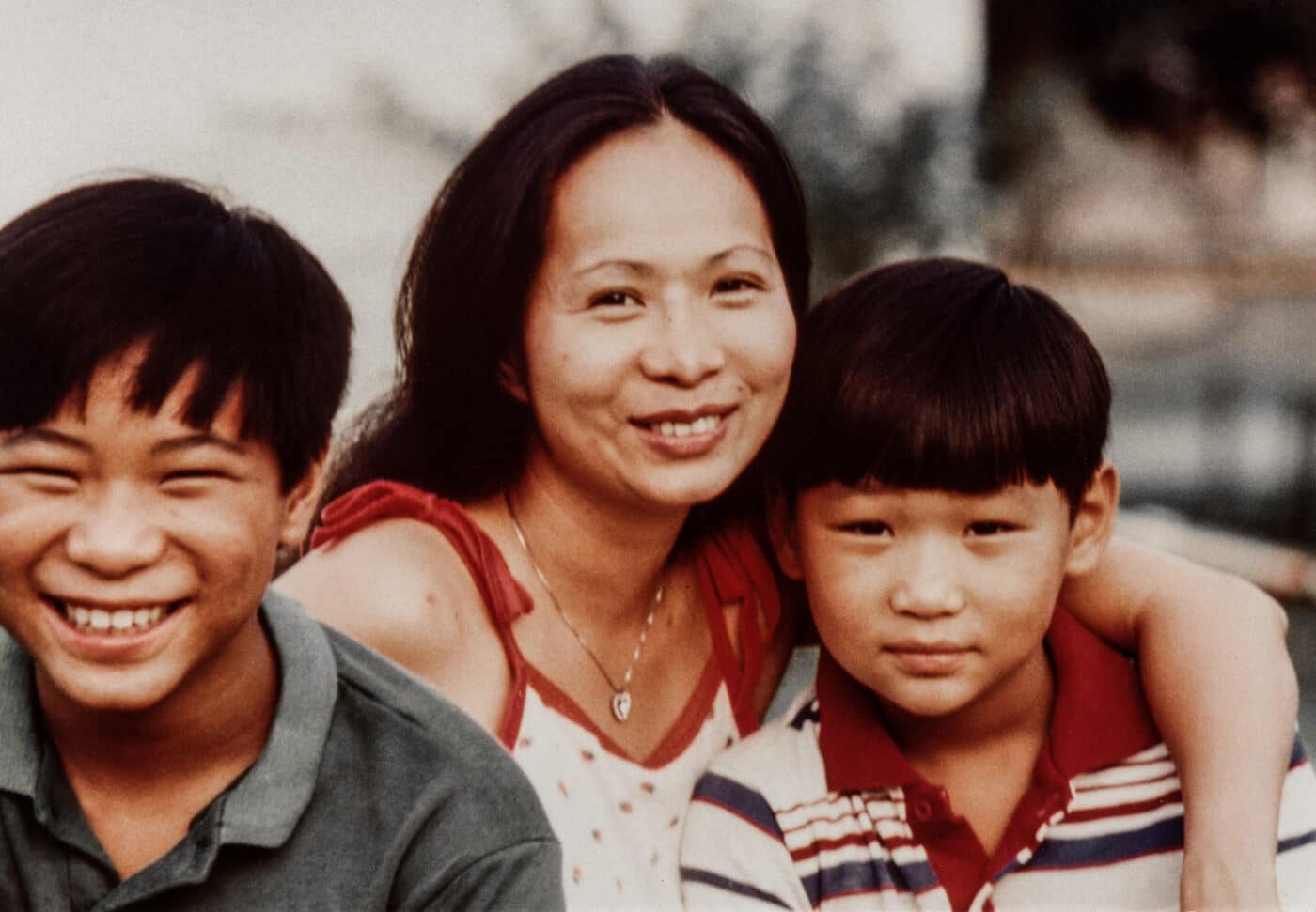 Tu Lam as a child with his mother and brother