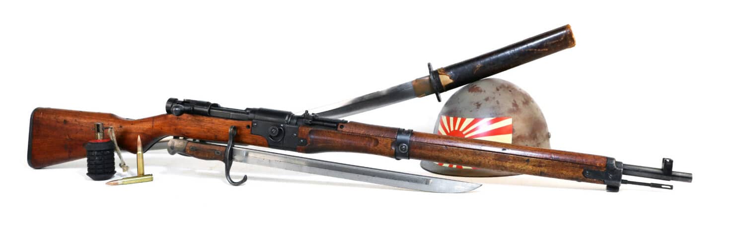 Japanese TERA Type 2 paratrooper rifle next to Japanese swords, helmet, and ammo