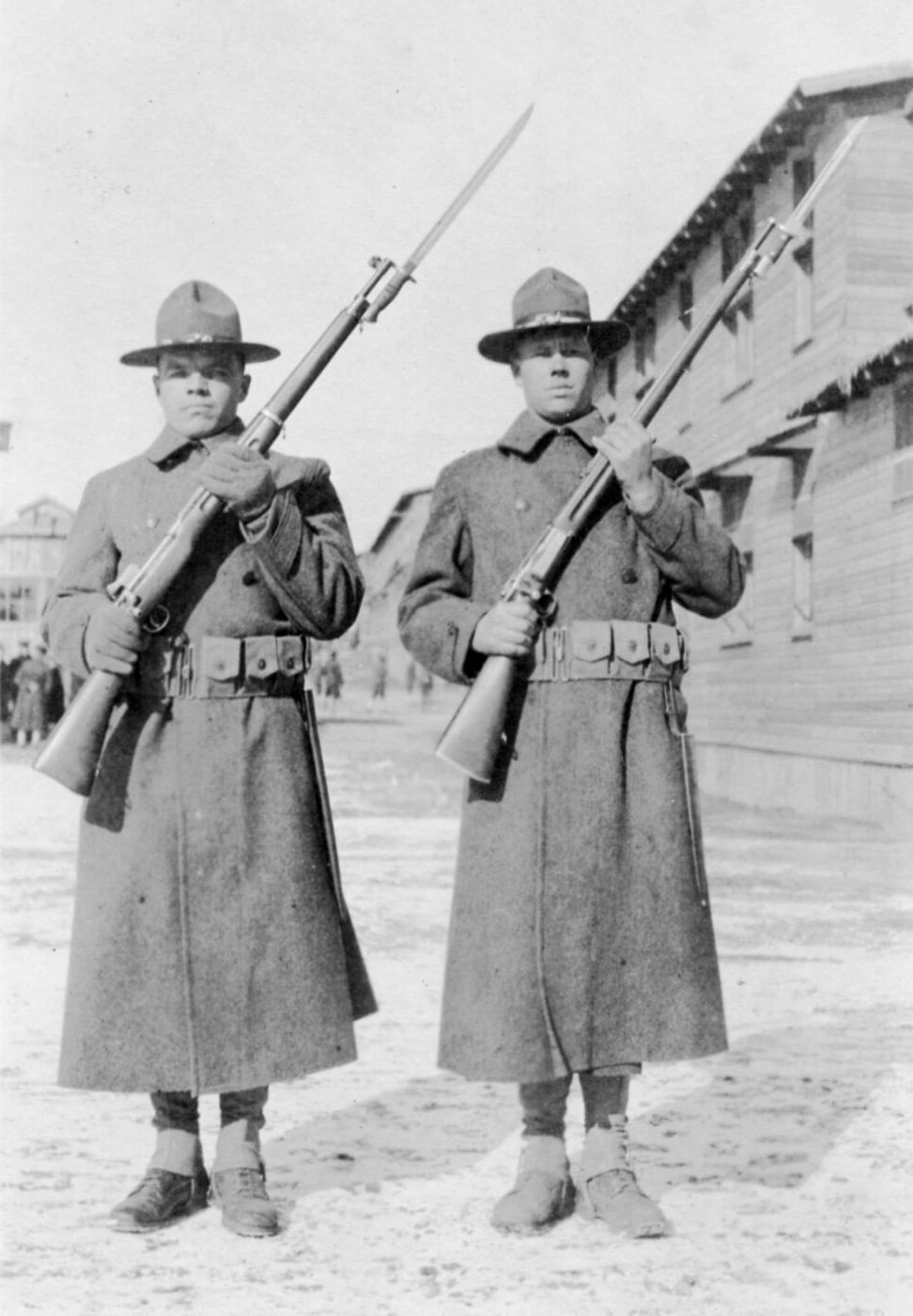 Two soldiers holding rifles