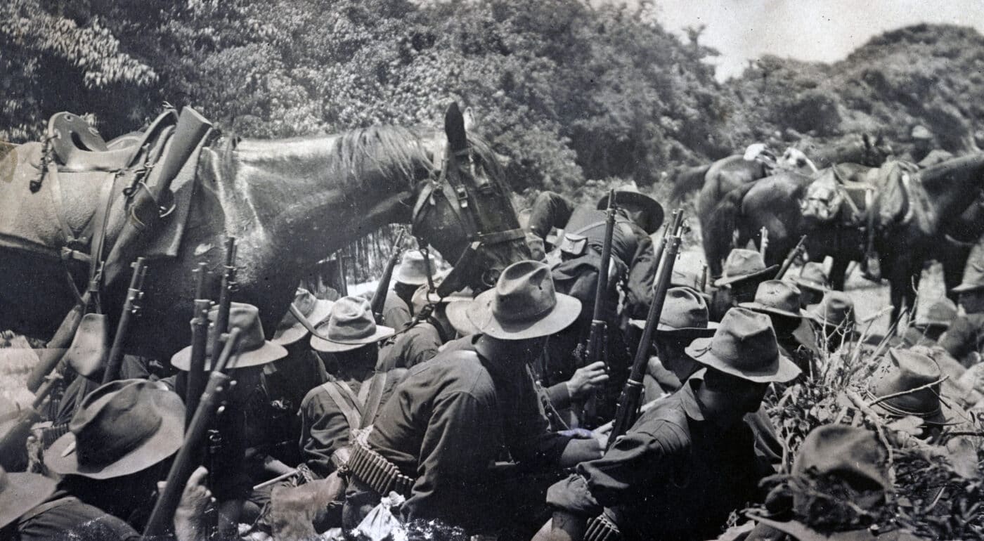 Krag rifles being carried by soldiers below San Juan Hill during the Spanish-American War