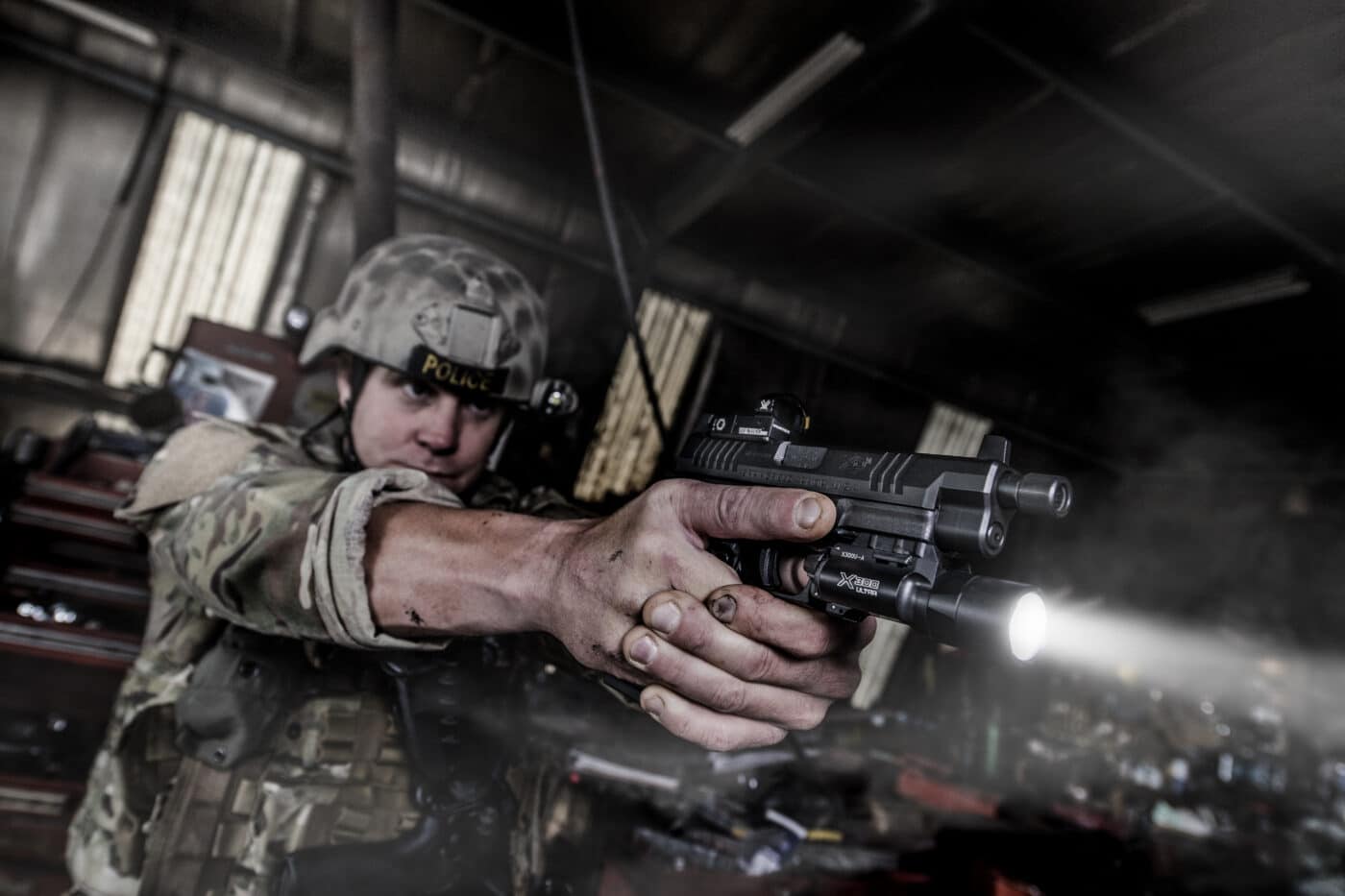 Soldier demonstrating tactical application of weapon-mounted light