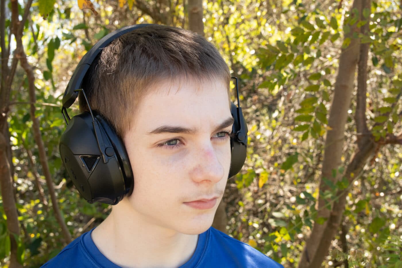 Young man wearing Peltor 500 ear protection at the range