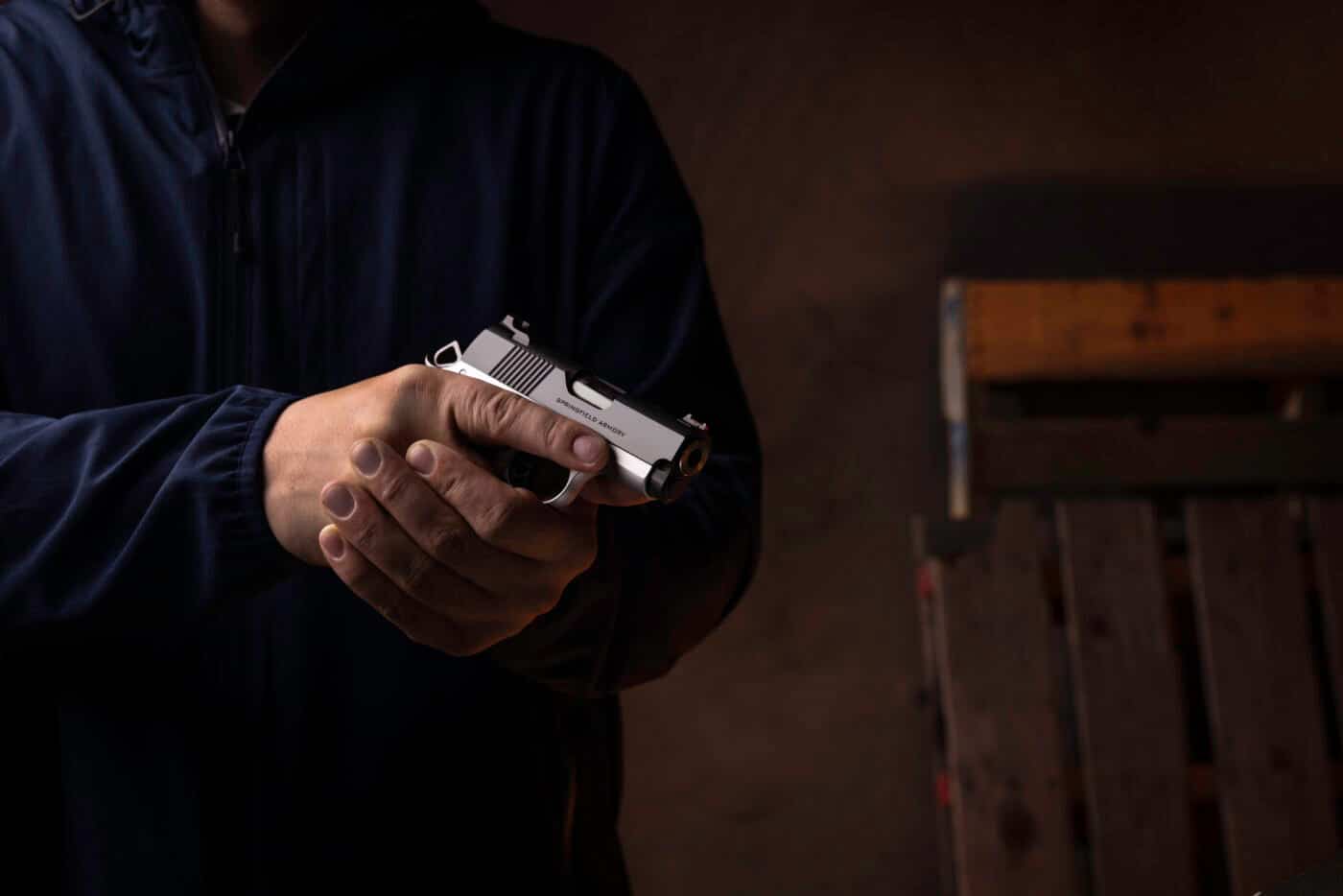 Man holding a micro-1911 for self-defense