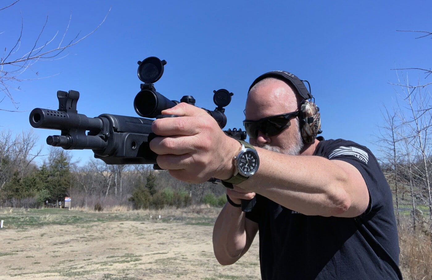 Man shooting M1A rifle with Ryker Grip installed
