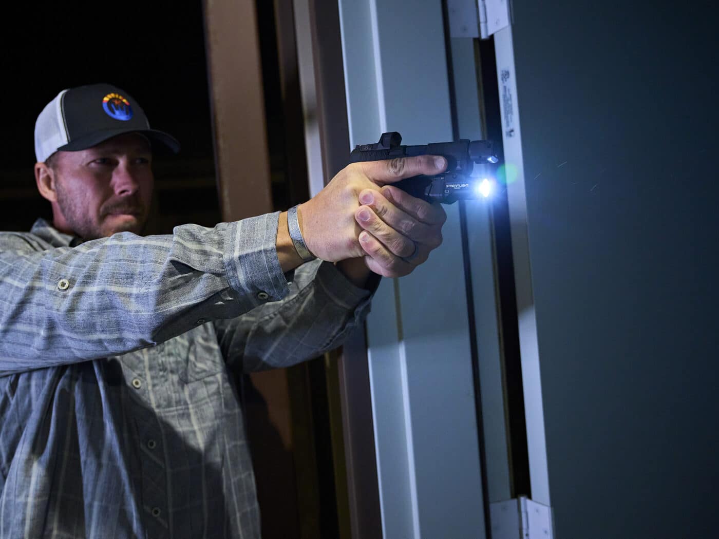 Man testing the TLR-7 Sub light in low light conditions