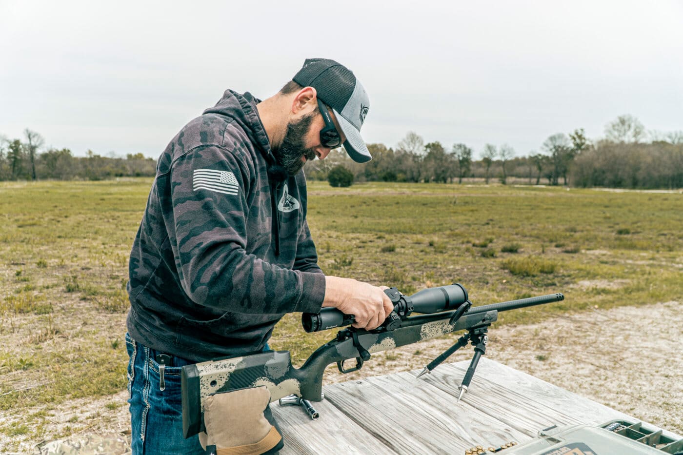Man properly mounting a scope on picatinny rail