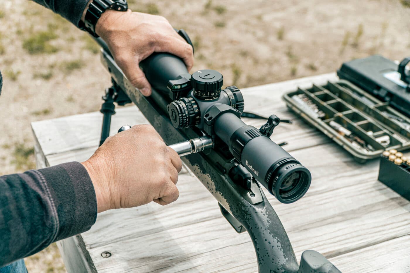 Man showing torque specs on scope rings