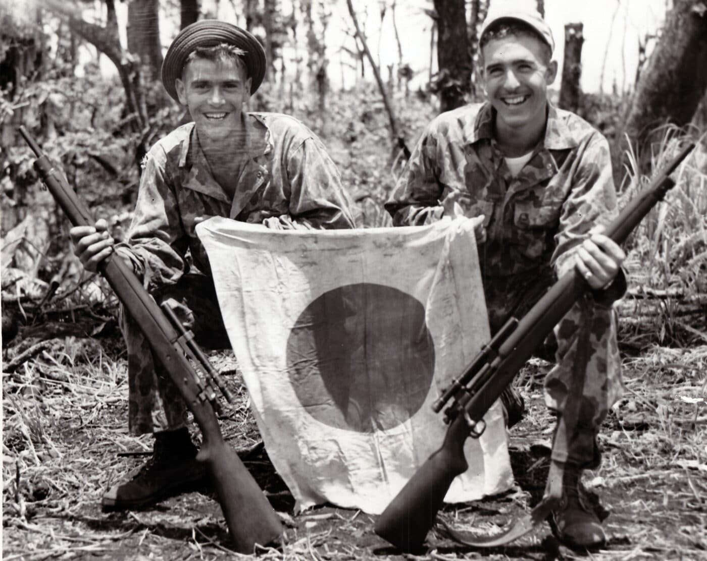 Two Marine snipers, who were former high school friends, holding Springfield 03A4 rifles