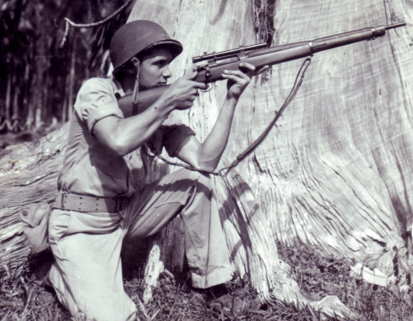 US Marine firing a Springfield 1903A4 sniper rifle during training exercises on Russell Island in 1945
