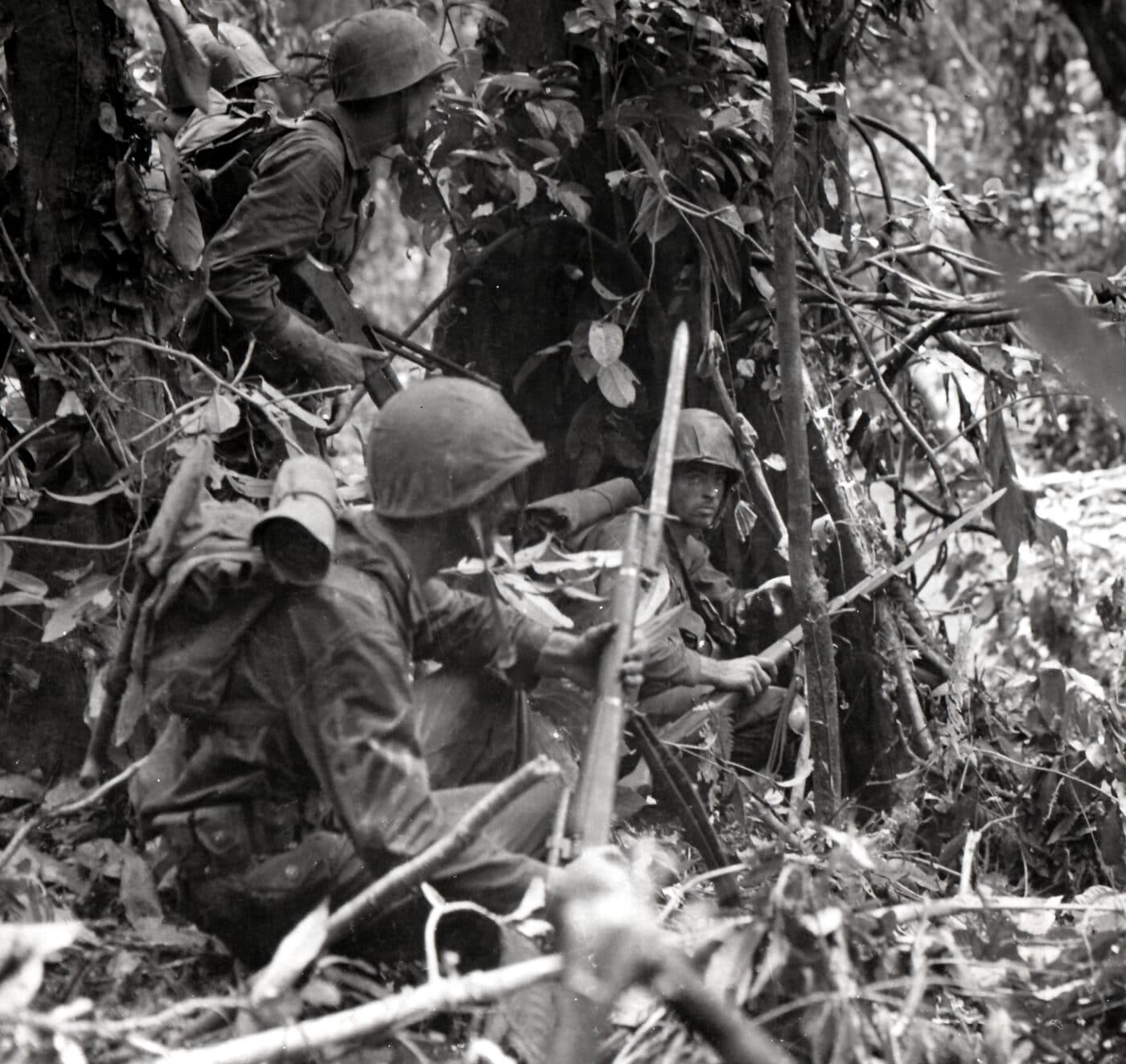 Marine carrying a Springfield 03A4 sniper rifle in Cape Gloucester