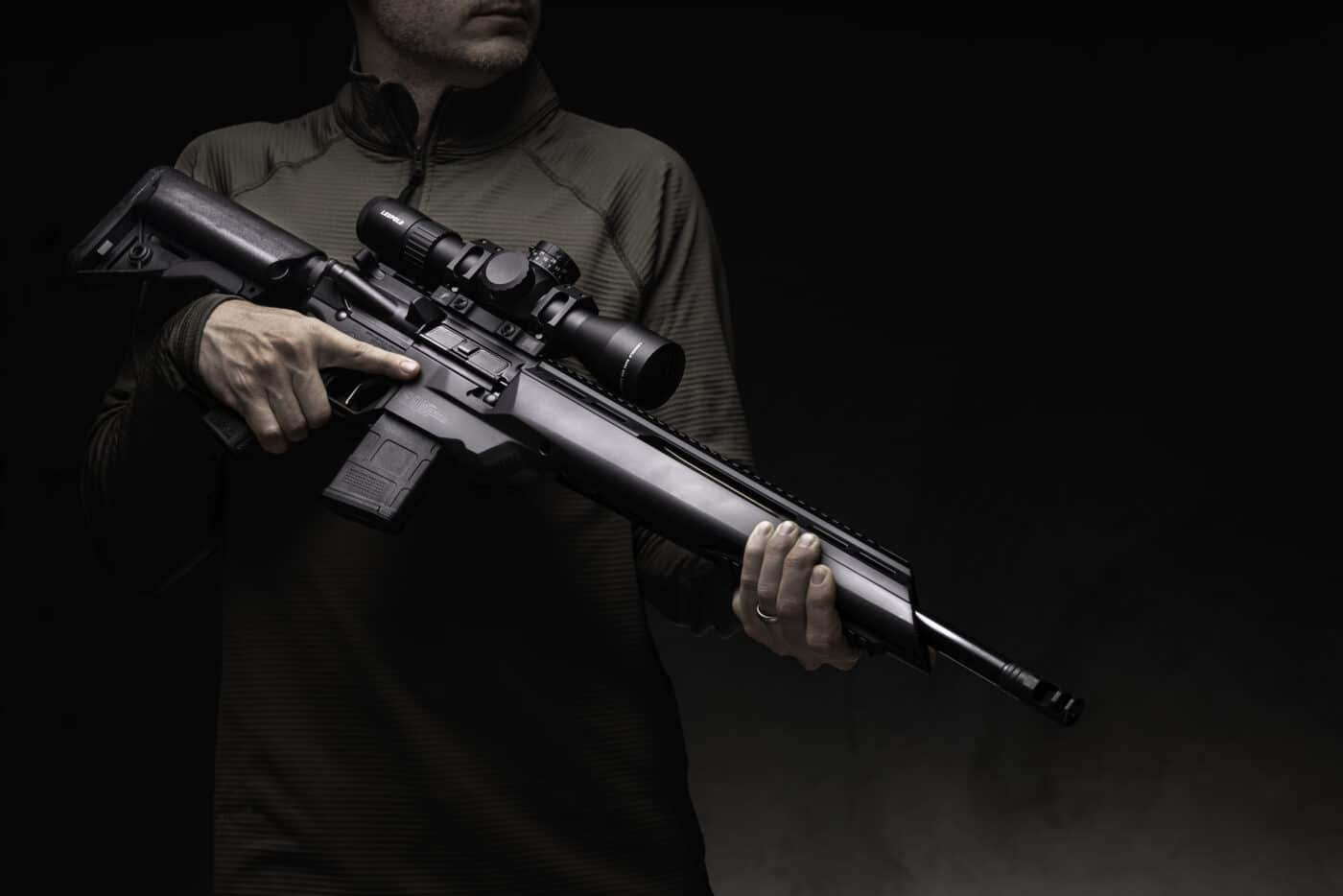 Man holding a Springfield SAINT Edge ATC rifle