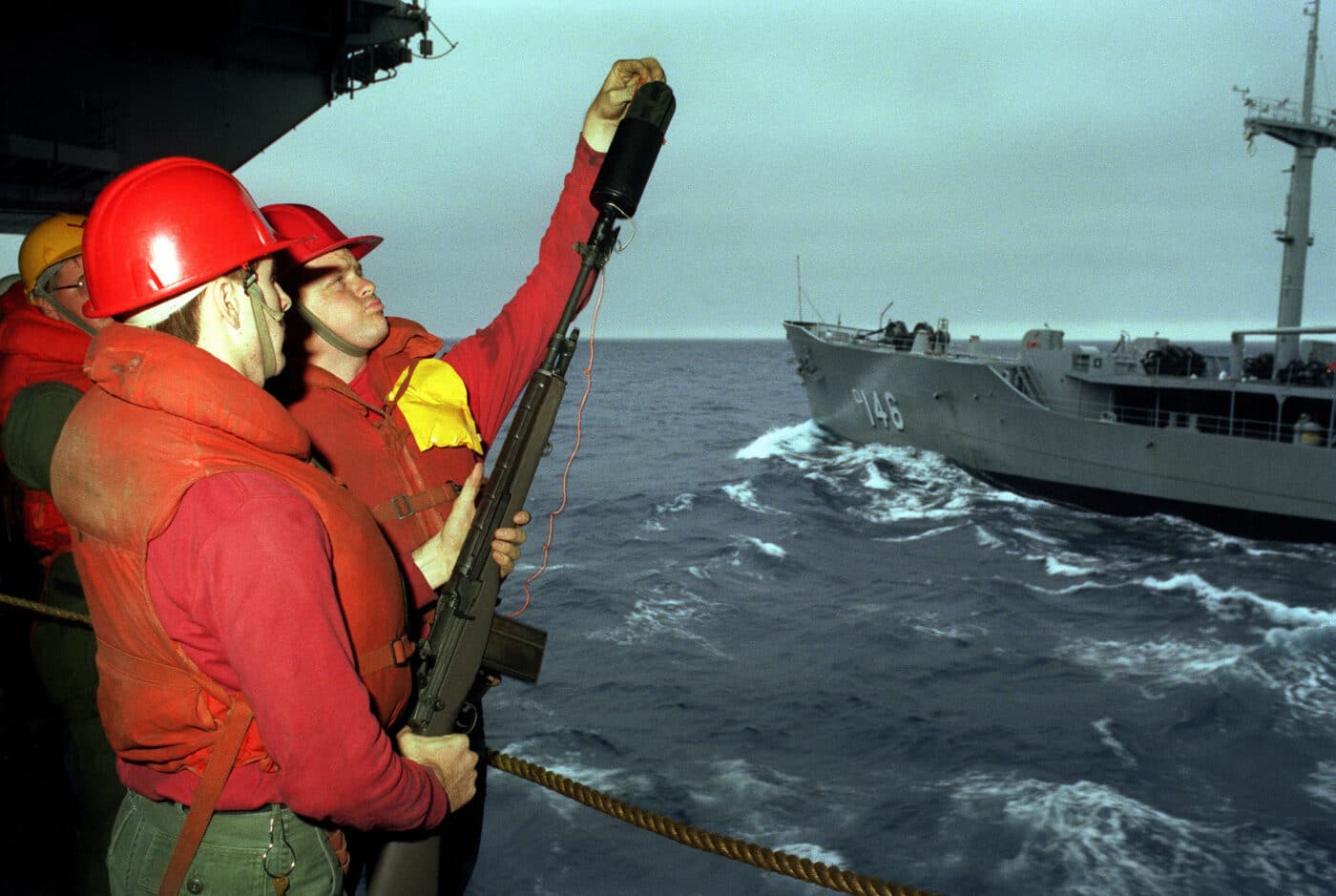 Sailors prepare an M14 line thrower in 1983