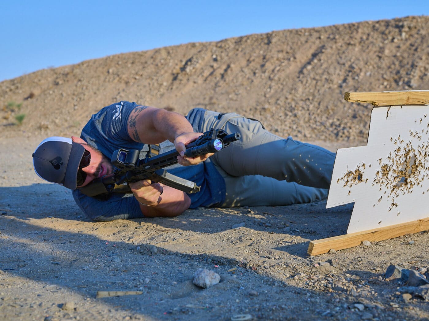 Man demonstrating emergency shooting position with a rifle