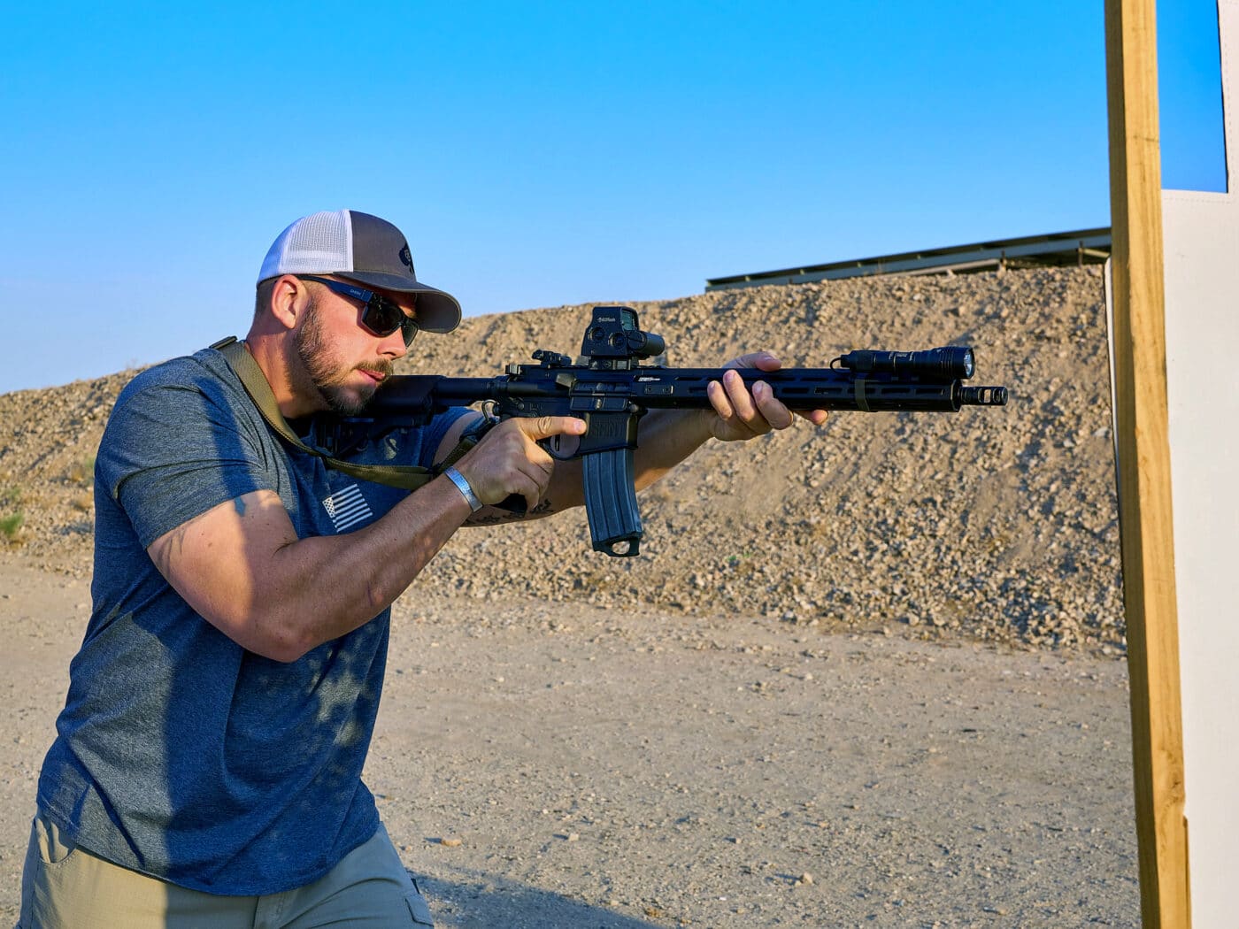 Man demonstrating a rifle shooting position during training