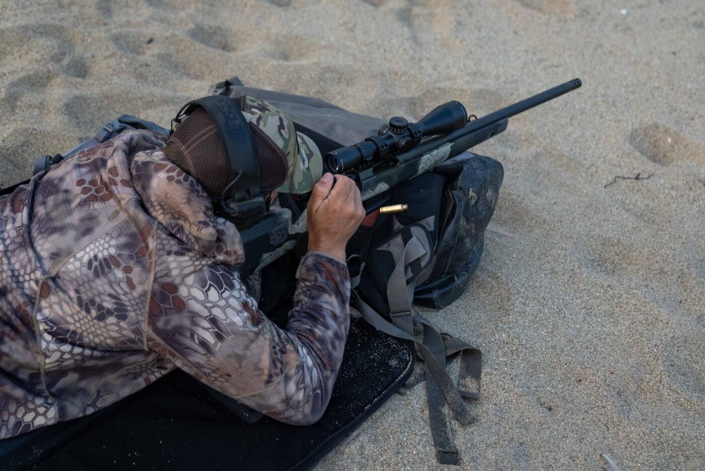 Man shooting a Model 2020 Waypoint rifle in prone position in Alaska