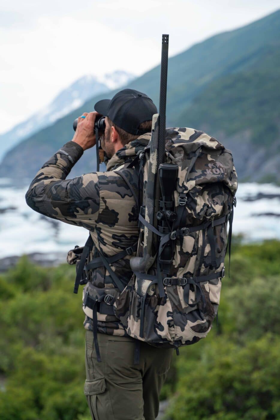 Man hiking with the Model 2020 Waypoint rifle