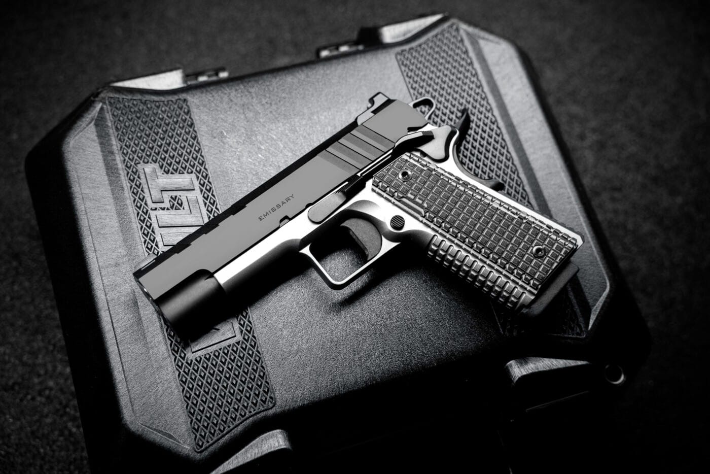 Springfield Emissary 9mm 4.25" pistol sitting on top of case