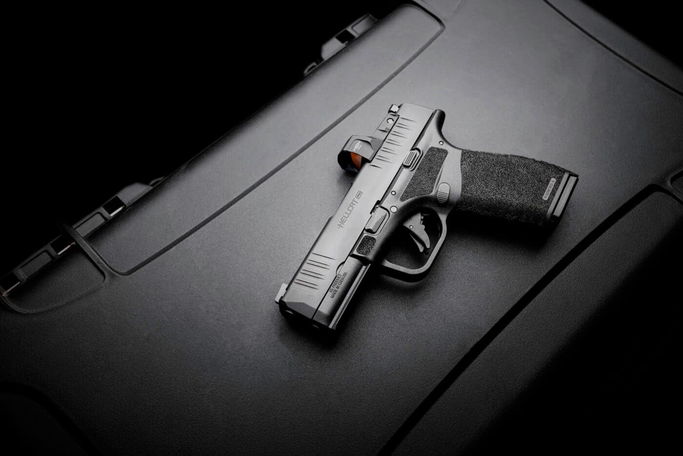 Springfield Hellcat Pro pistol on top of case