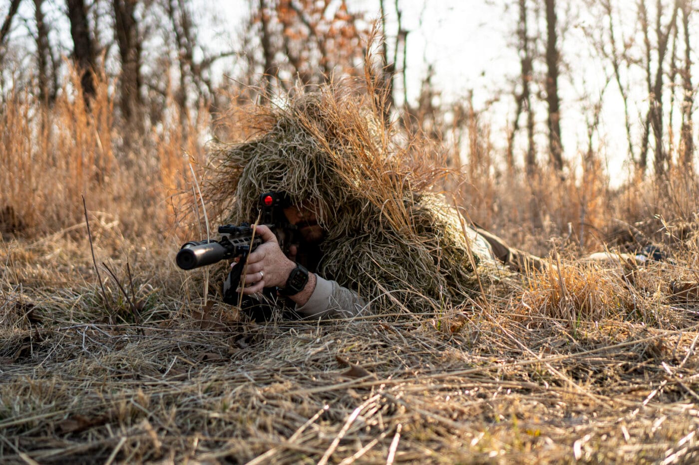 Man wearing homemade ghillie suit