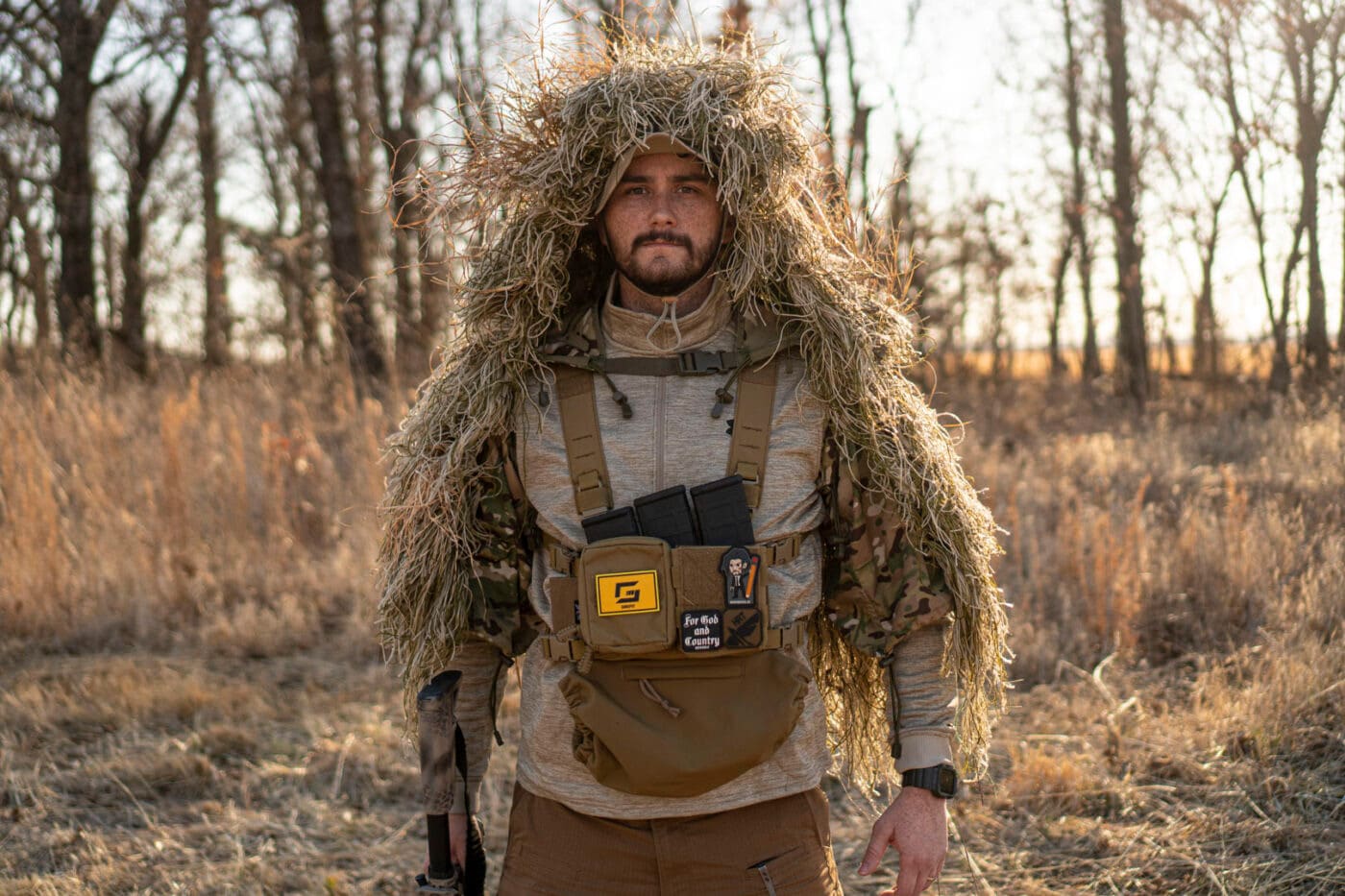 Man wearing ghillie suit