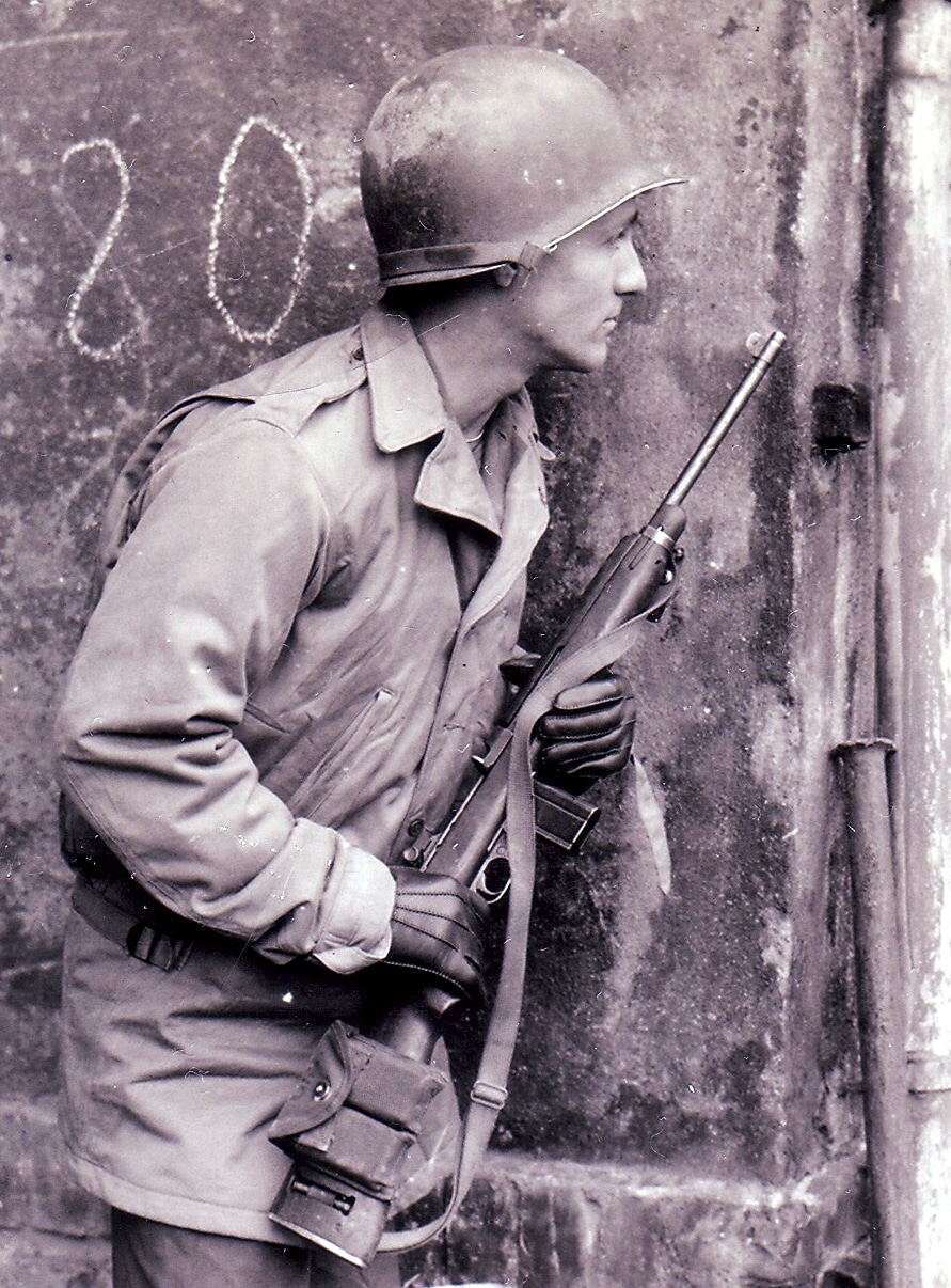 A soldier of the 89th Infantry Division holds and M1 Carbine in Werdau, Germany in the spring of 1945