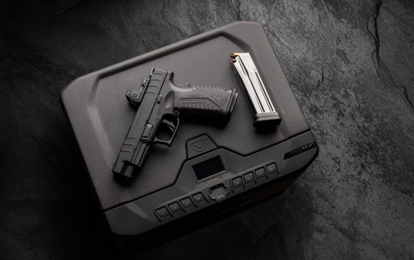 Springfield Armory XD-M Elite 4.5" 10mm pistol on top of Vaultek safe