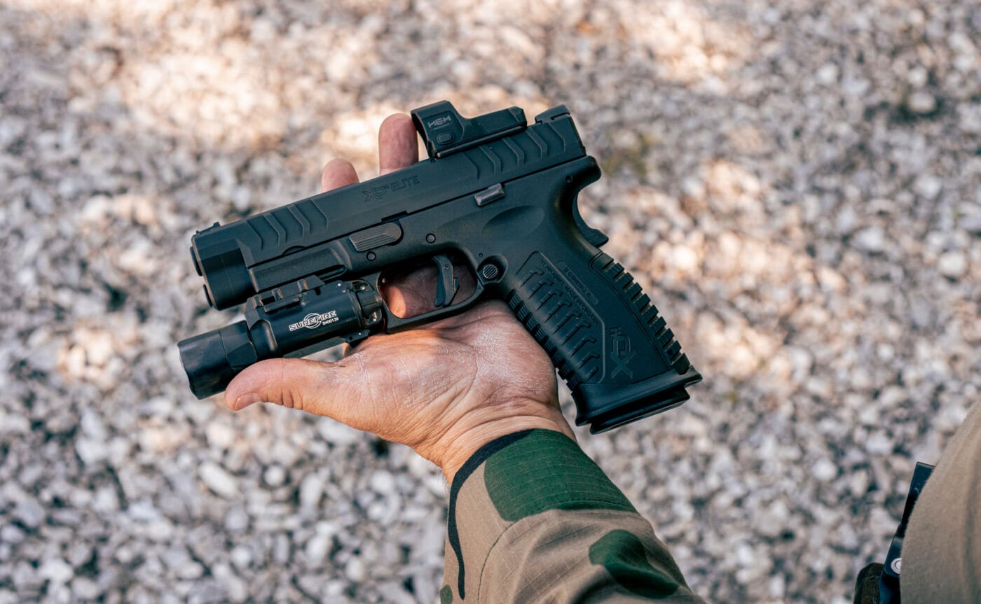 Springfield Armory XD-M Elite 10mm 4.5 inch pistol being held in one hand during a review