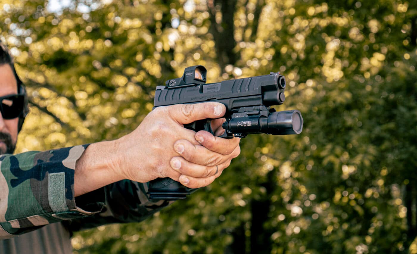 Man shooting a Springfield Armory XD-M Elite 10mm 4.5" during range testing