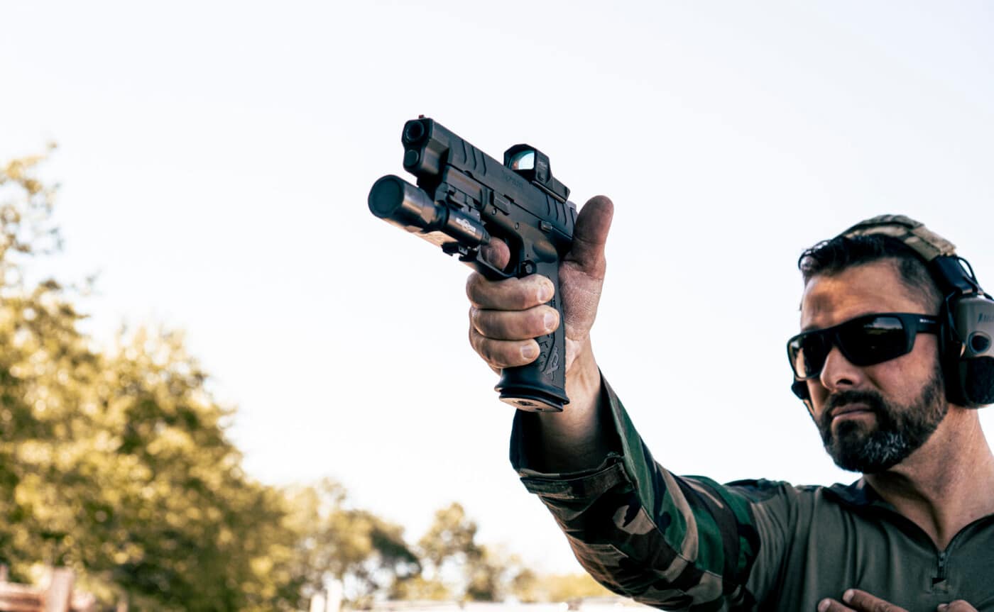 Man shooting the XD-M Elite 10mm 4.5" on the range