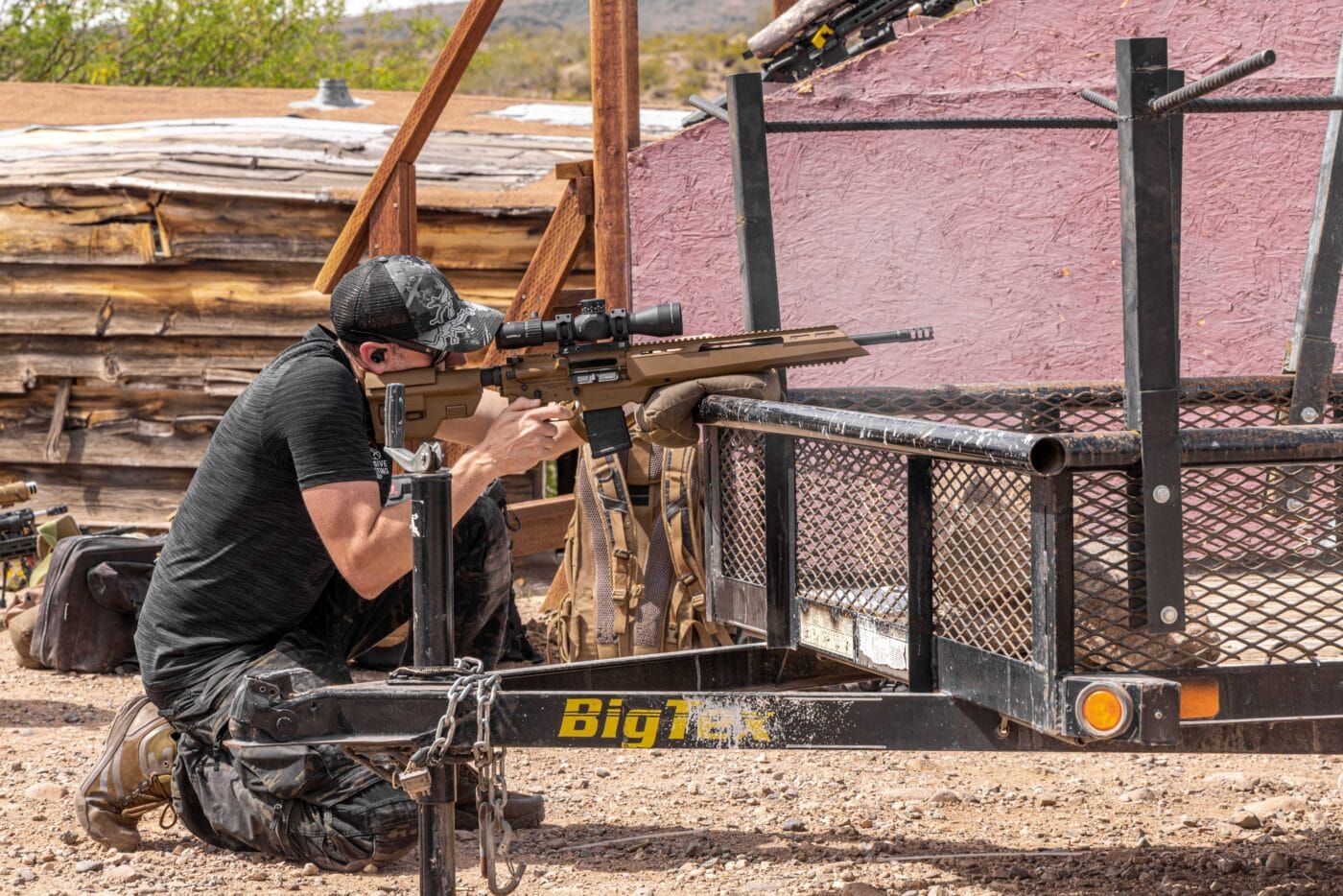 Man using improvised brace during rifle shooting competition