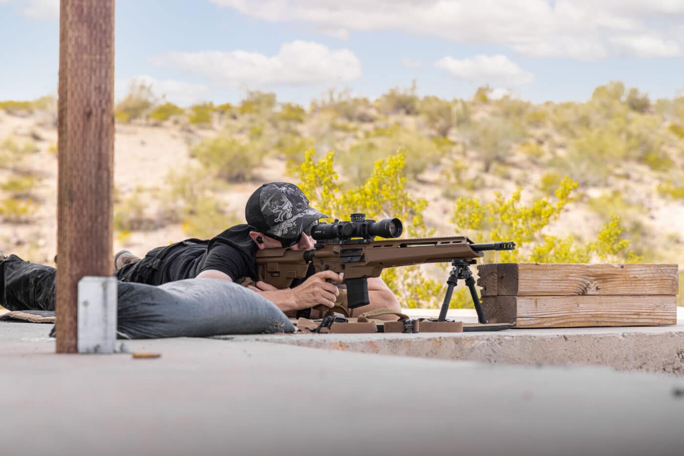Man shooting rifle prone using a bipod during AR accurized match
