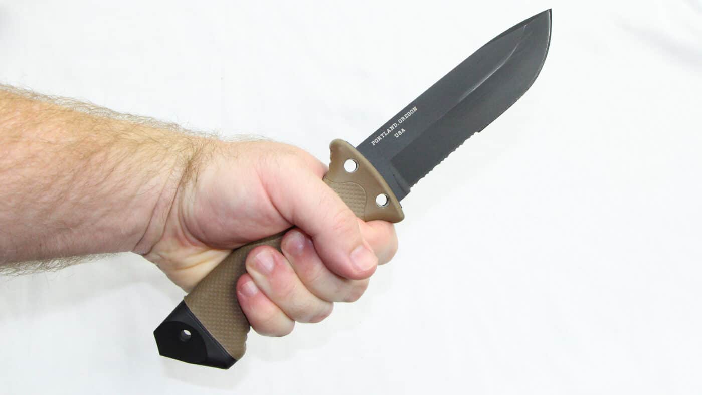 Man demonstrating using knife as a deadly weapon