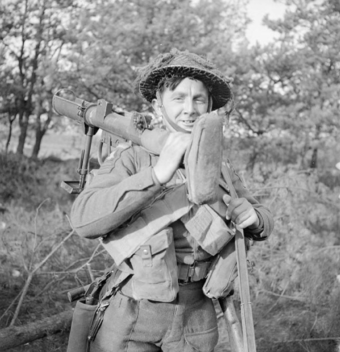 A British infantry soldier carrying a PIAT