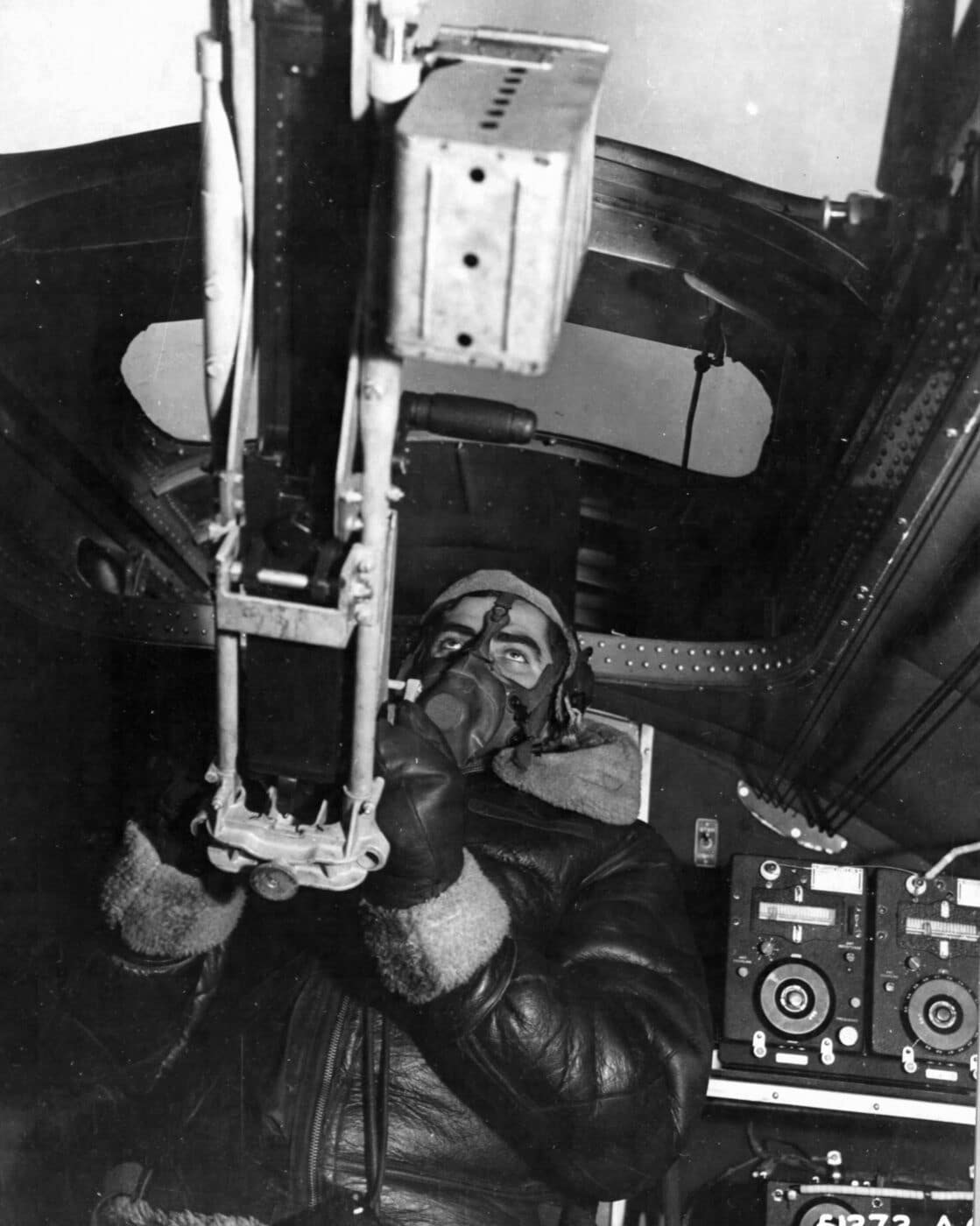 A B-17 radio operator uses his AN/M2 .50 caliber MG