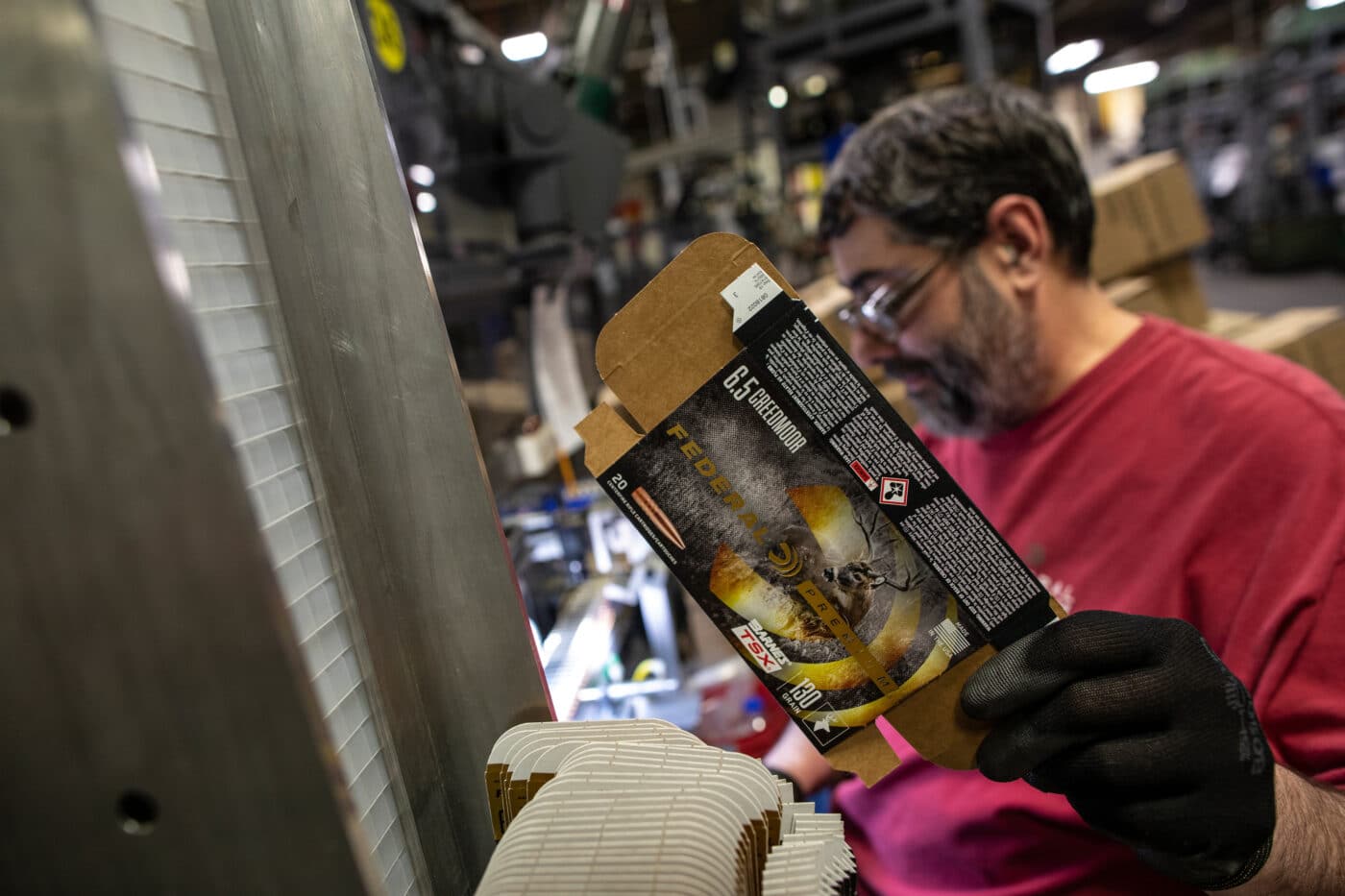 Man holding a box for Barnes TSX ammo by Federal