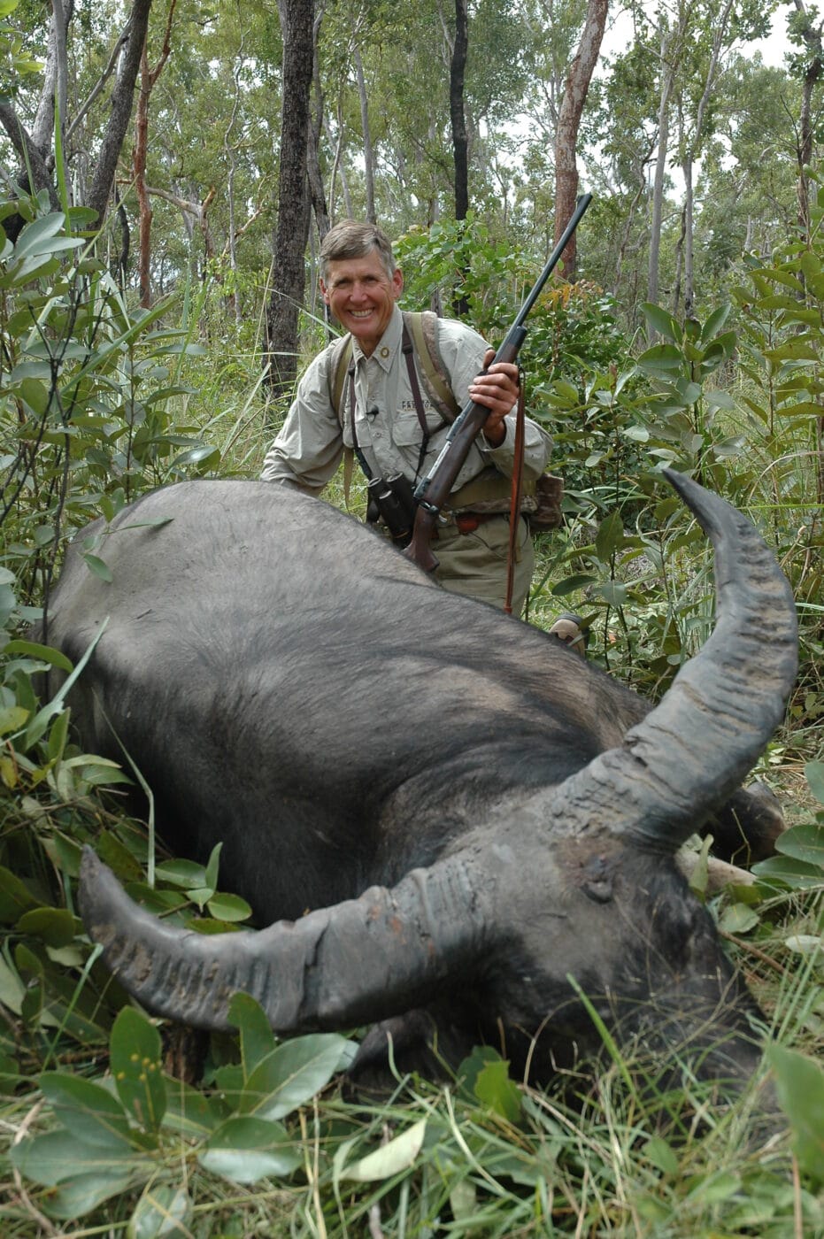 Man posing with Australian buffalo shot at 27 yards with a .338 Magnum Federal load with a Trophy Bonded bullet