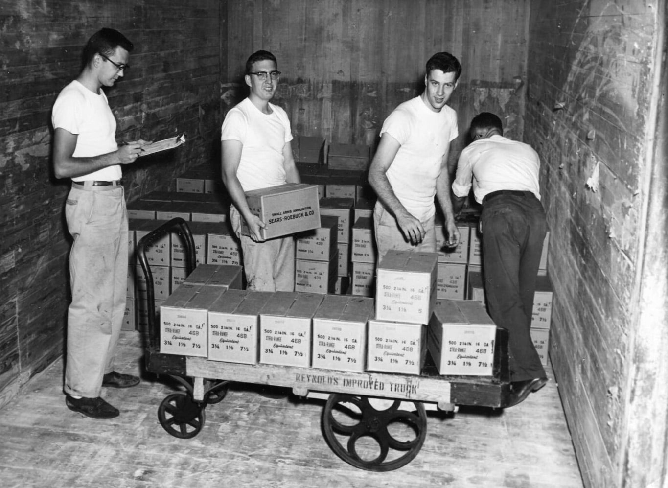 Men loading shotshell boxes in Federal warehouse
