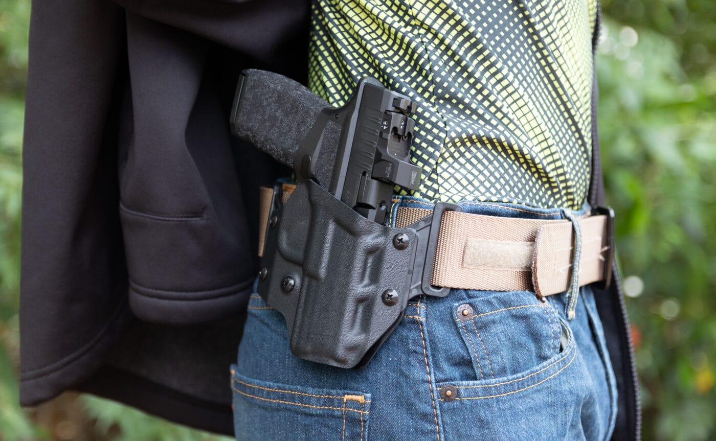 Man with Crucial Concealment Covert OWB Holster for the Hellcat Pro on belt
