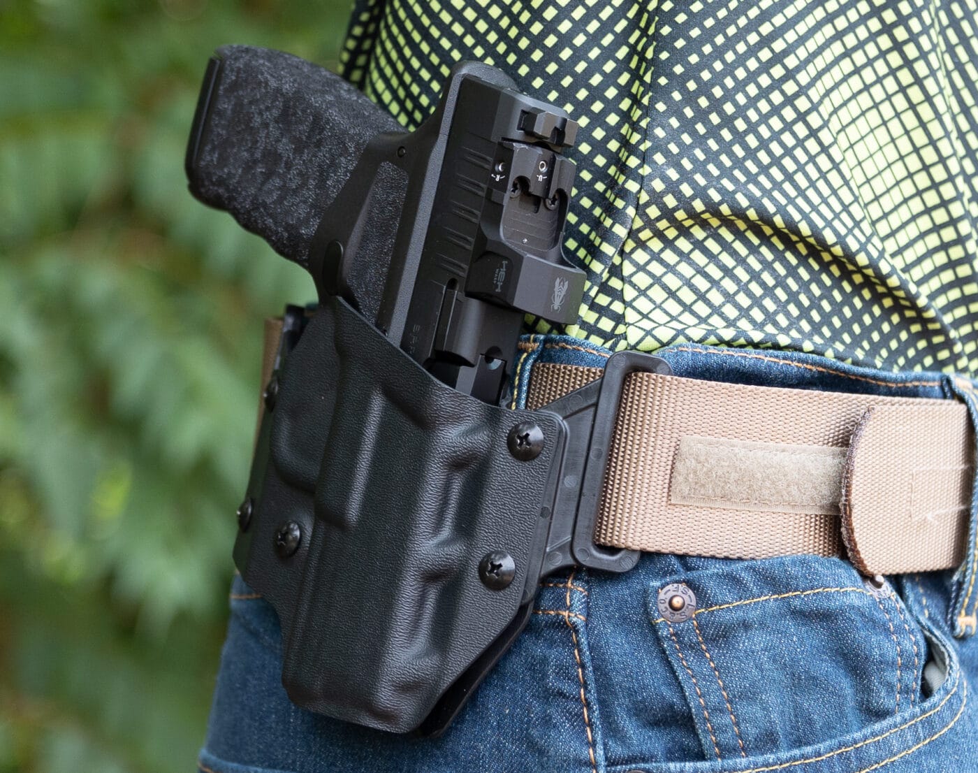 Crucial Concealment Covert OWB Holster for the Hellcat Pro being carried on belt